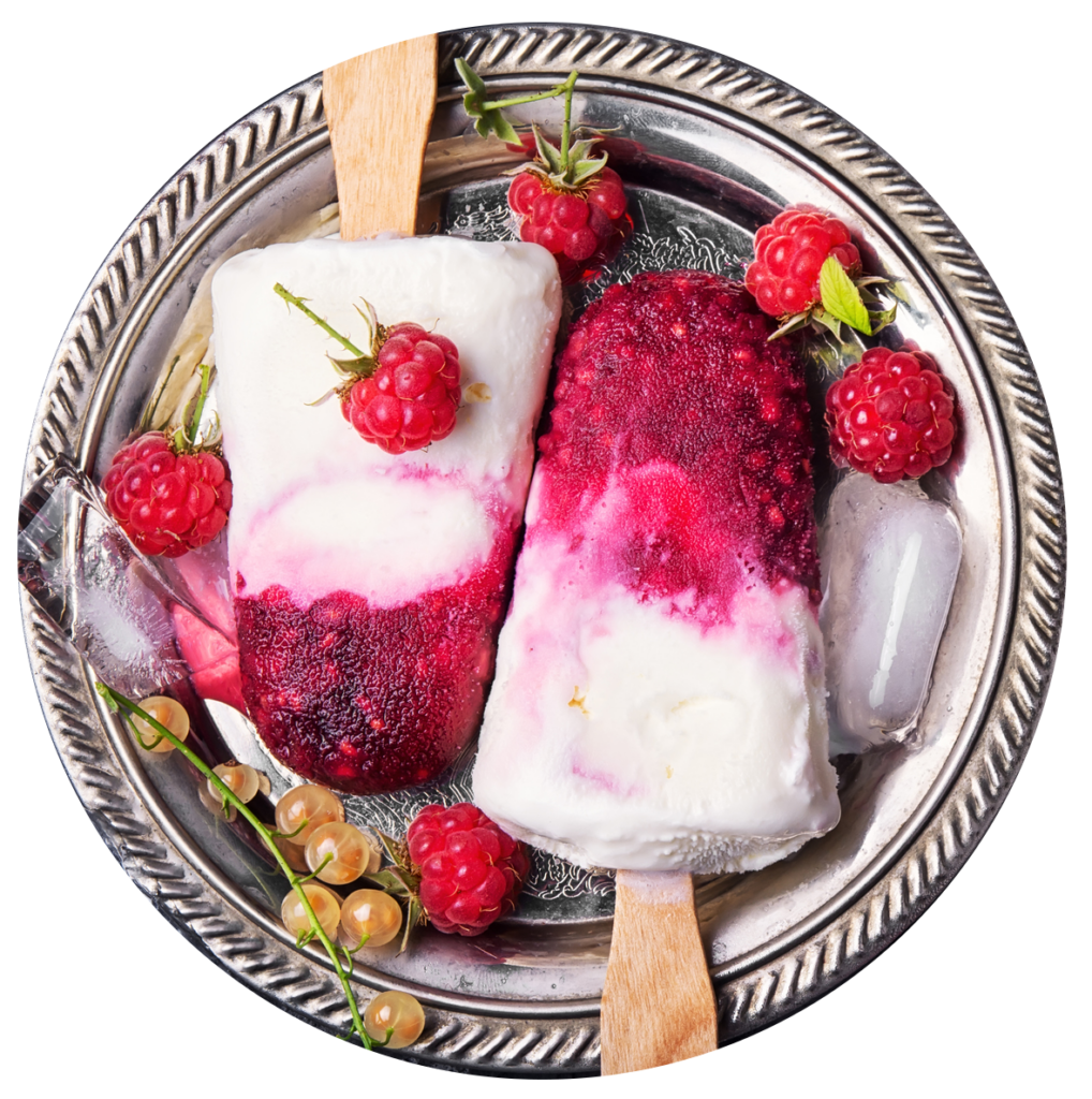 Raspberry ice cream bars with sticks and fruits