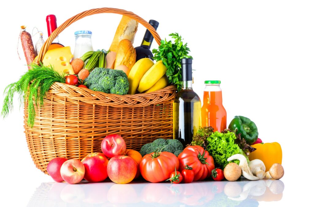 Vegetables and juice bottles in basket