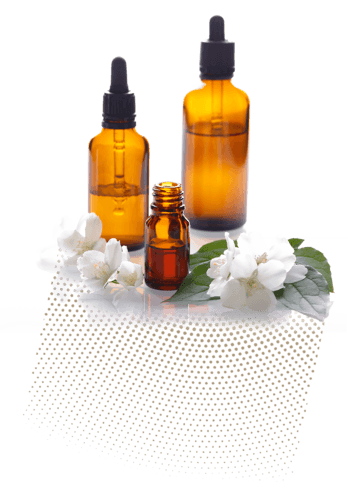 Essential oil bottles with jasmine flowers on side