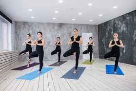 Group of ladies practicing yoga
