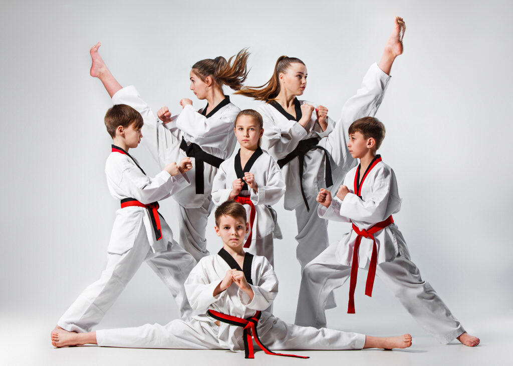 Group of kids training karate