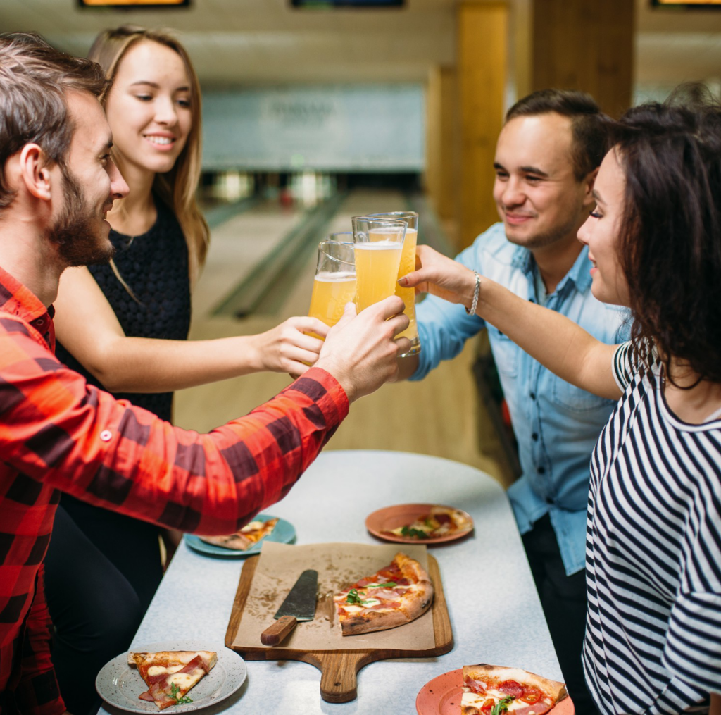 Group of people enjoying food and drinks