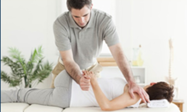chiropractor treating patient