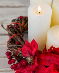 Lit candles inside wreathe