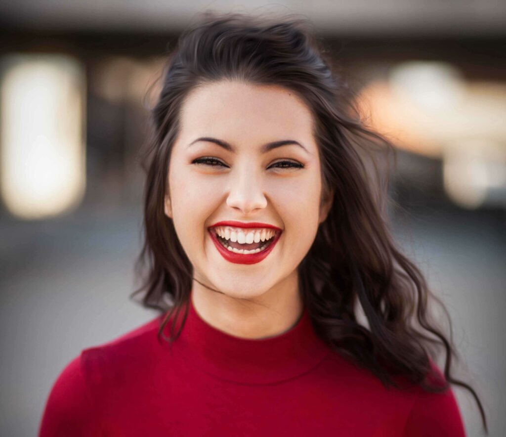 woman in red top laughing