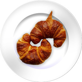 Two croissants in a plate